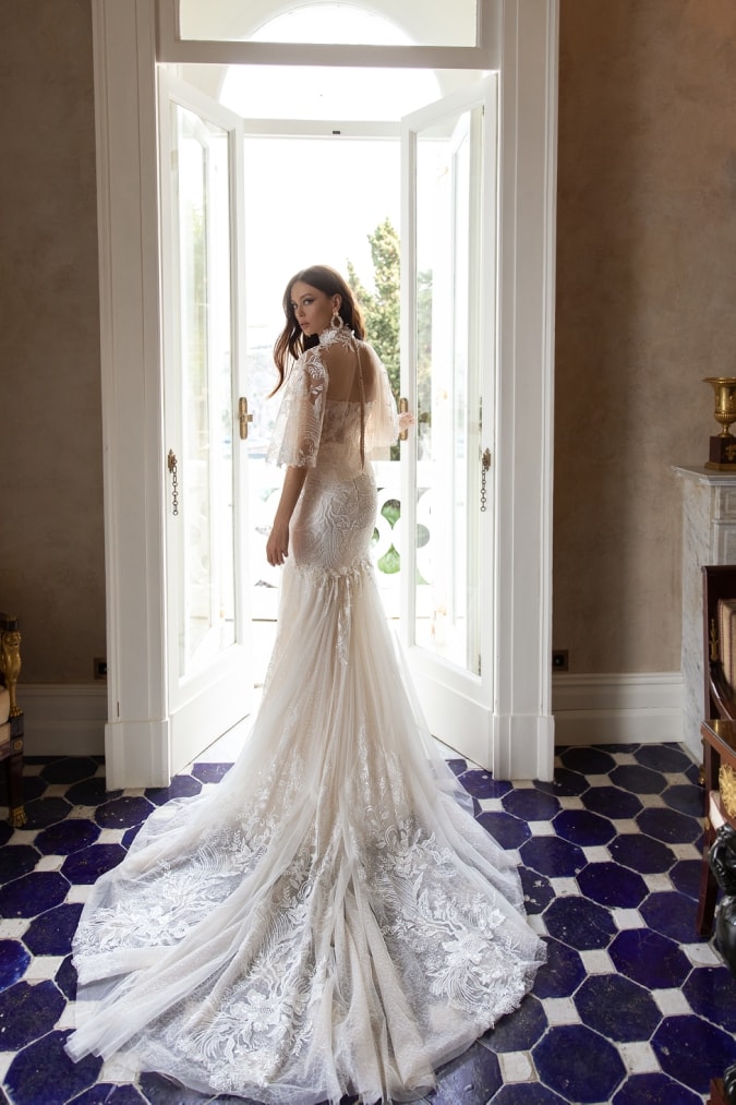 Long lace wedding dress with lace cape